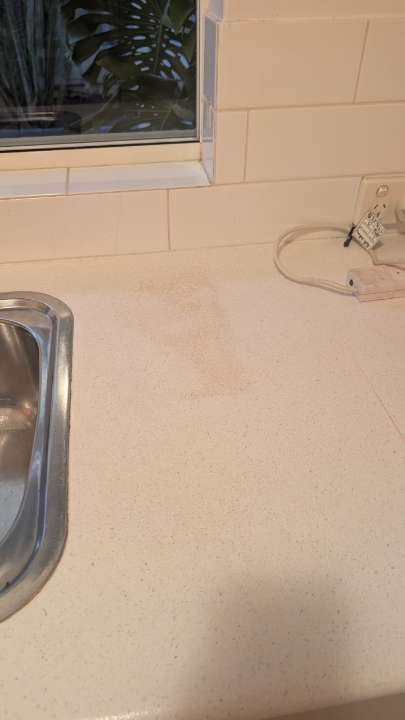 Completed kitchen benchtop beside the installed sink
